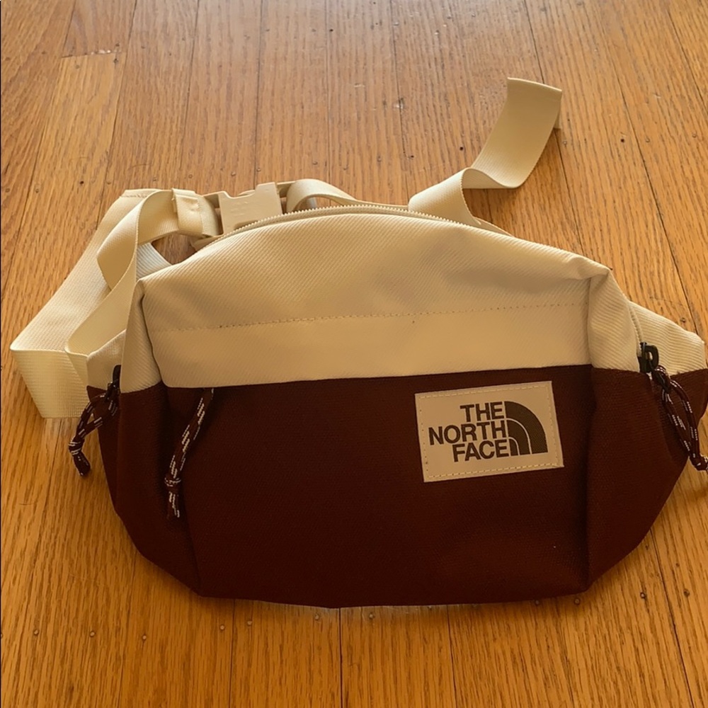 Maroon and cream North Face belt bag